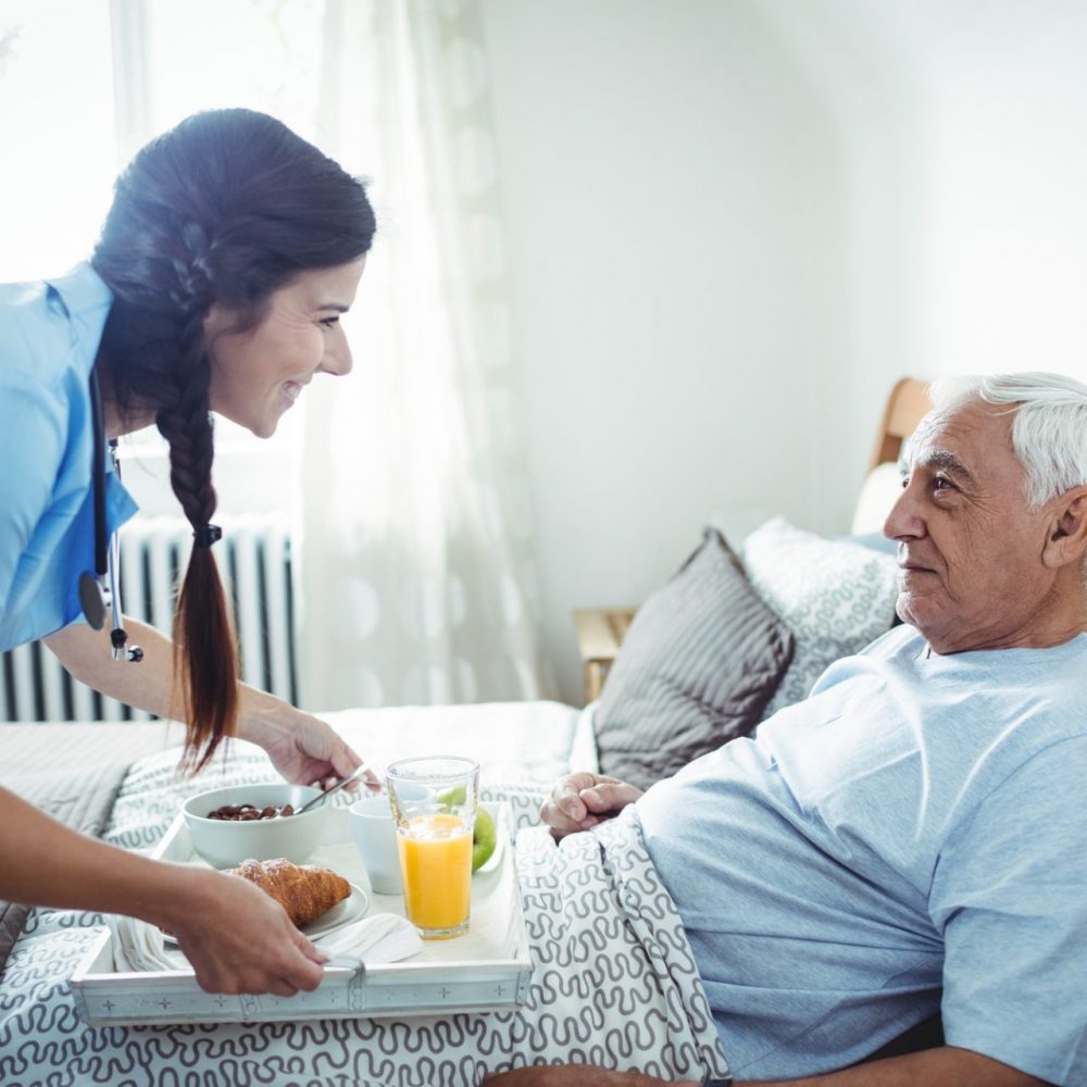 Home care nurse taking care of a older person